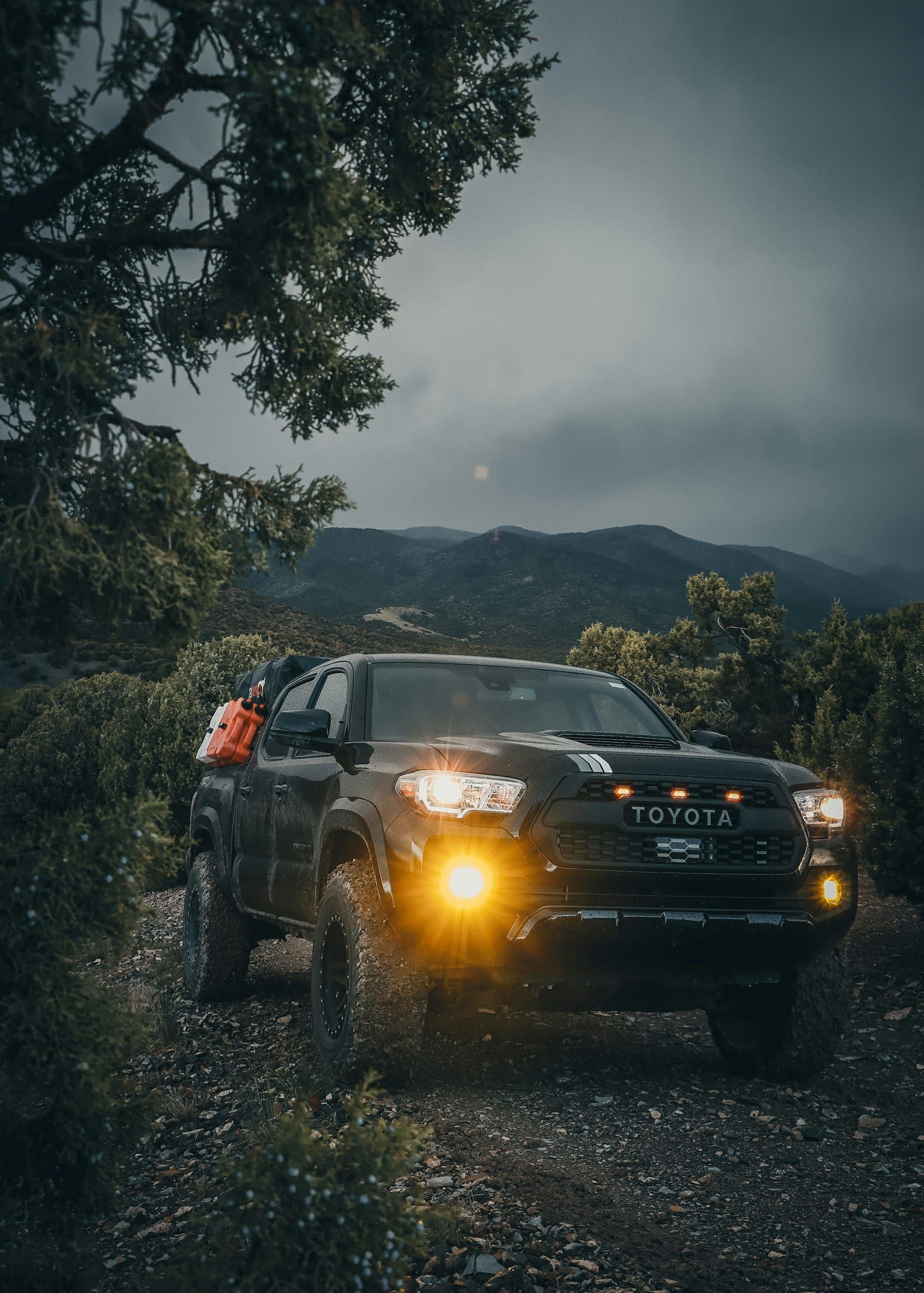 Toyota Tacoma on dirt road — mid-size install platform